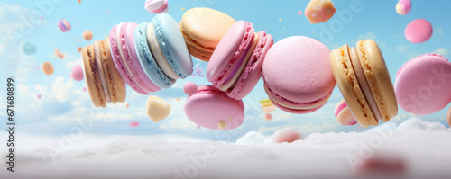 Different types of macaroons in motion falling on a colorful background photo