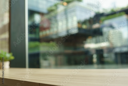 empty wood table by window in town