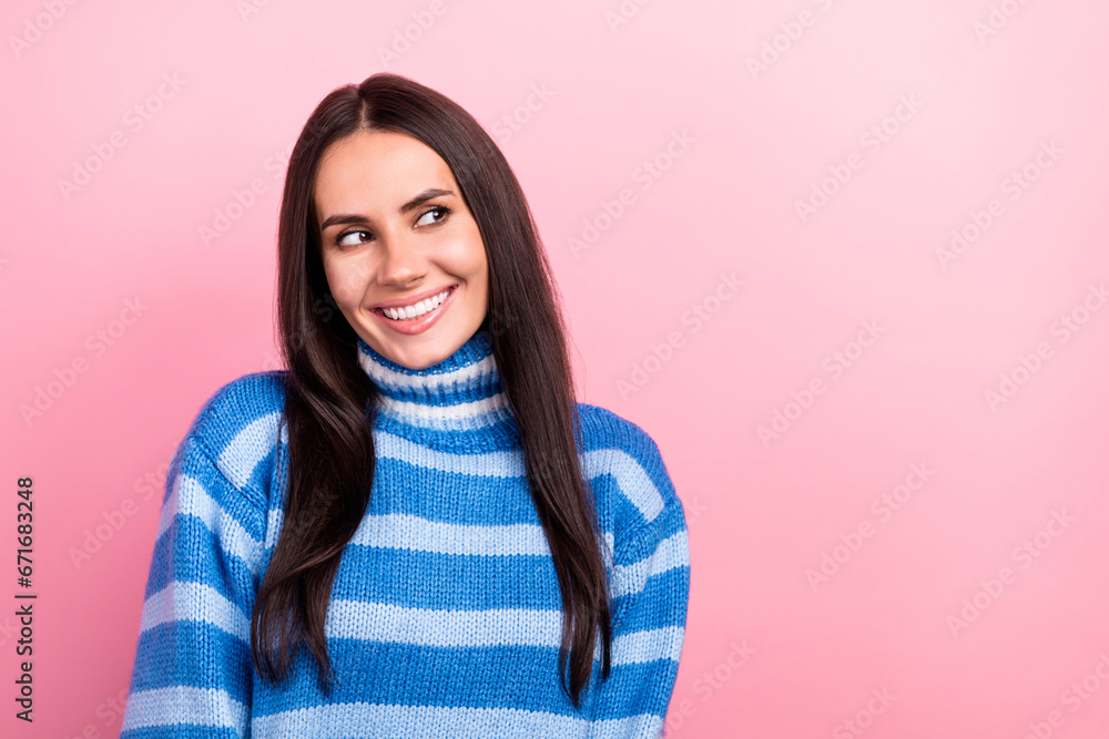 Photo of nice pretty positive person beaming smile look interested empty space ad isolated on pink color background Photo of nice pretty positive person beaming smile look interested empty space ad isolated on pink color background