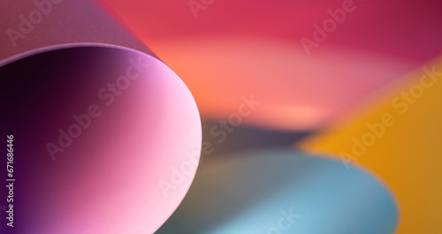 Colorful abstract paper texture background. Curled sheets of paper. Oval shape. Macro photography.  Desktop wallpaper. Horizontal banner. Pastel colors.