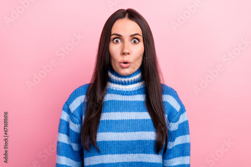 Photo of pretty shocked speechless girl pouted lips staring cant believe wear turtleneck isolated on pink color background