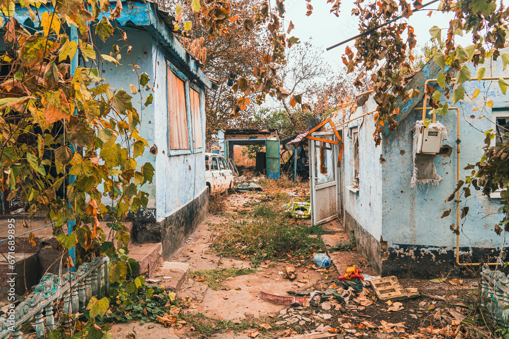 Countryside. The yard in front of the house was destroyed by shelling. War in Ukraine Countryside. The yard in front of the house was destroyed by shelling. War in Ukraine