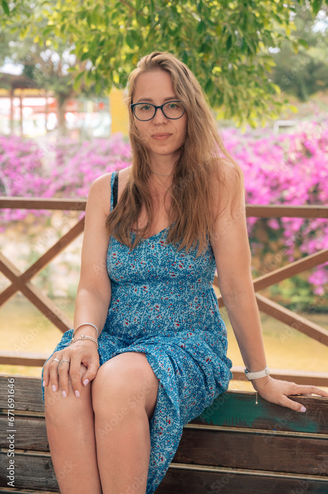 Woman sits on the bench in Alanya city, Turkey. Travelling or vacation concept