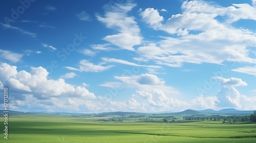 a beautiful cloudy blue sky with green field