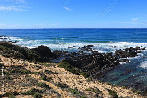 Beautiful cliffs and coves with black basalt rocks in the coast of Alentejo  Portugal