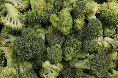 Fresh raw broccoli as background  top view