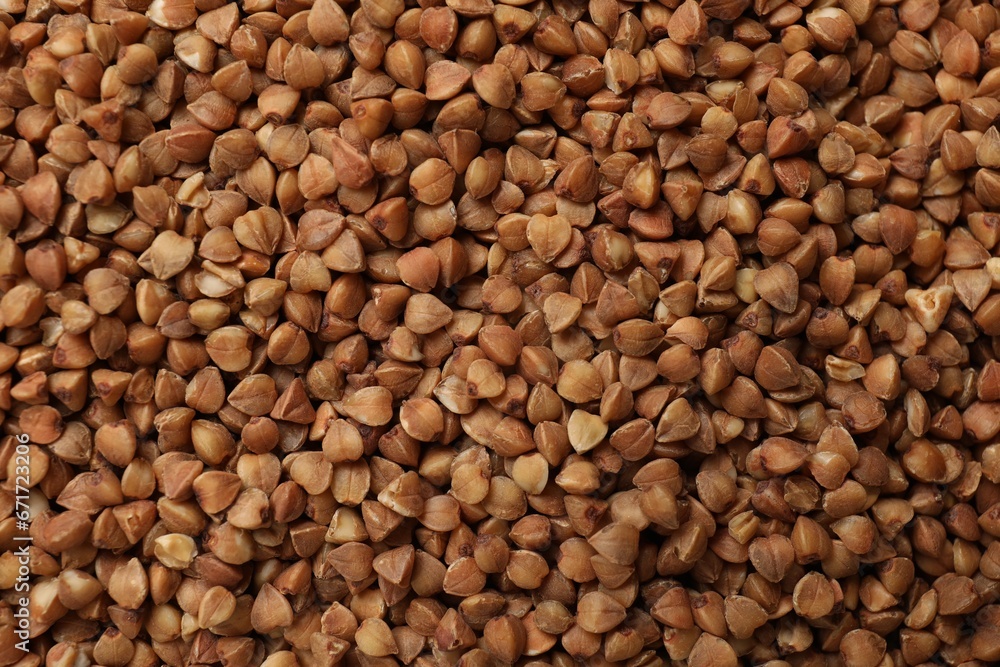 Dry buckwheat grains as background, top view Dry buckwheat grains as background, top view