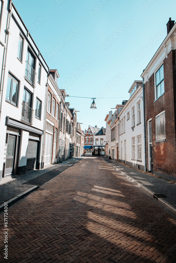 Typical historic town street in Zwolle in the east of the Netherlands. Exploring Dutch cities during daytime