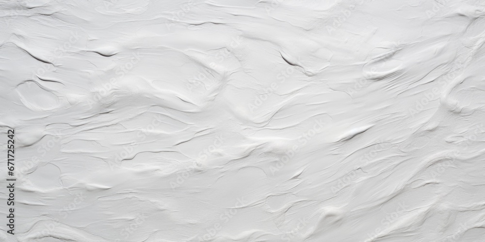 Obraz premium A close up view of a white wall with paint splatters. This image can be used for interior design, home improvement, or artistic projects