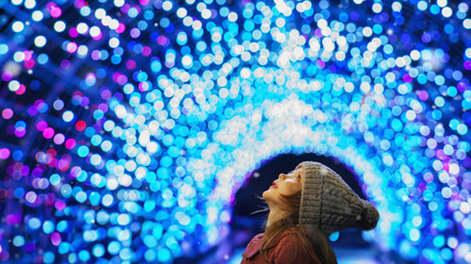 A little girl rests on top at christmas - childhood belief
