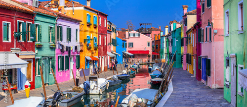 Italy travel and landmarks. Most colorful places (towns) - Burano island, village with vivid houses near Venice. photo