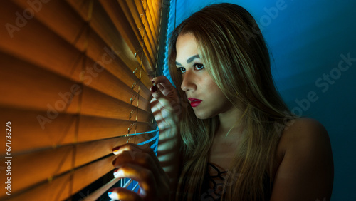 Beautiful view of woman looking through blinds, looking through, night, looking, night light, facial expressions