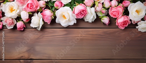 White and pink small roses on painted wooden planks with space for text © Vusal