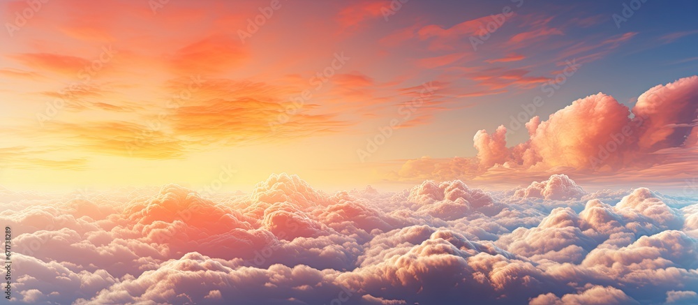 The colors of the setting sun envelope the sky with billowy clouds The colors of the setting sun envelope the sky with billowy clouds