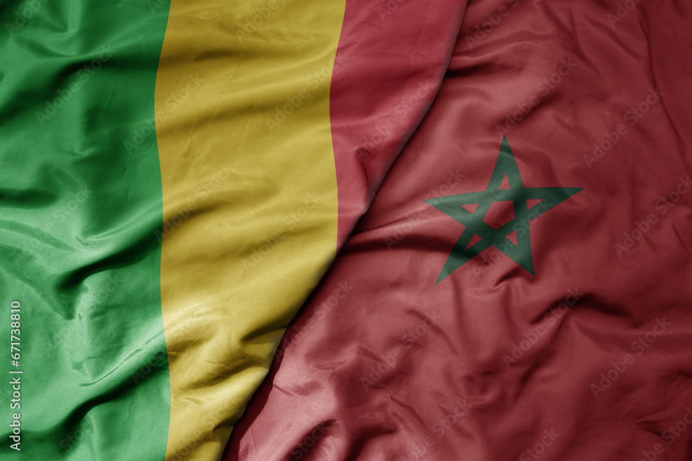 big waving national colorful flag of mali and national flag of morocco . big waving national colorful flag of mali and national flag of morocco .