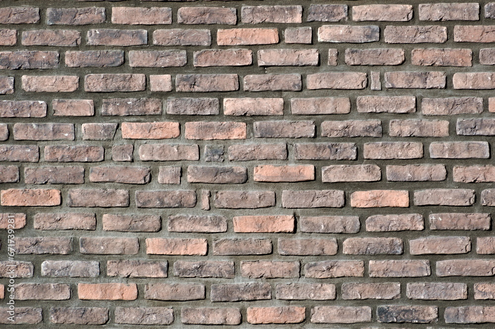 Brick wall facade. Abstract background photo. Lovely plastic texture facing on the building. Possible to use as pattern background. Ideal to place text. Brick wall facade. Abstract background photo. Lovely plastic texture facing on the building. Possible to use as pattern background. Ideal to place text.
