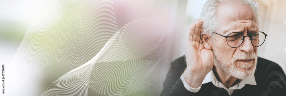 Obraz na plátně Senior man with hearing problems; panoramic banner