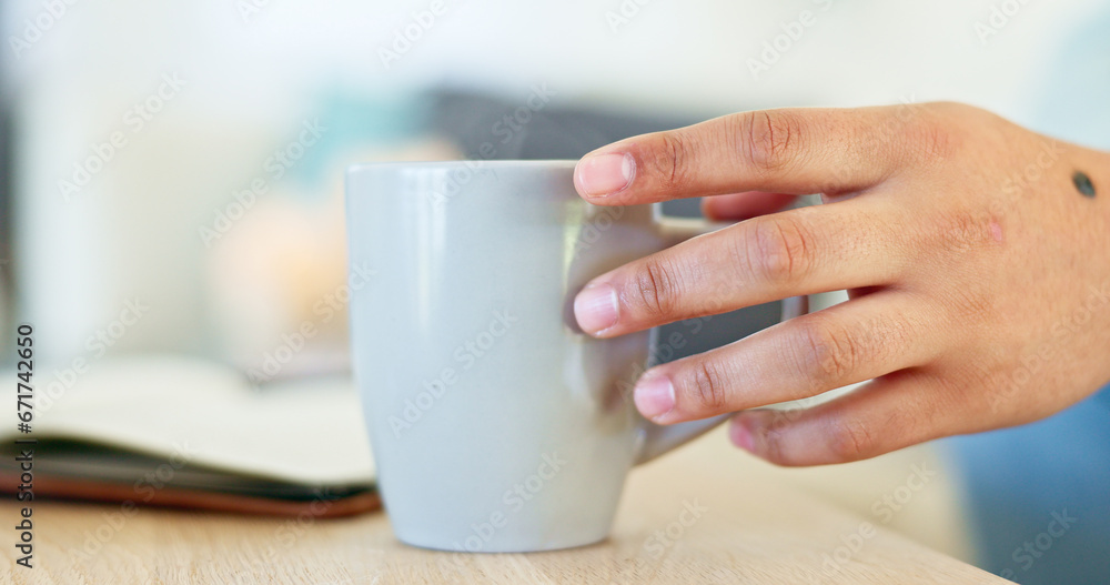 Closeup, hand and a person with coffee and a notebook in the morning for reflection, relax or reading. House, table and a person with a latte, tea or a warm drink in the morning with a journal Closeup, hand and a person with coffee and a notebook in the morning for reflection, relax or reading. House, table and a person with a latte, tea or a warm drink in the morning with a journal