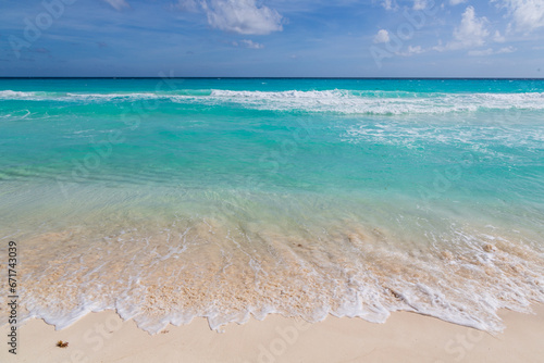 Turquoise water of Caribbean Sea, sandy beach, blue sky, good for background. Cancun, Mexico © Анастасия Смирнова