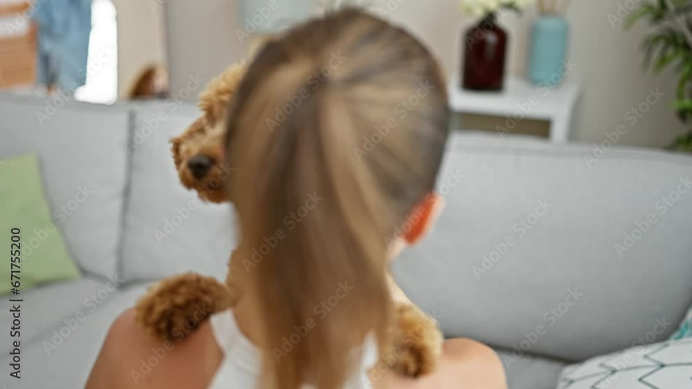 Young caucasian woman with dog hugging backwards at home Young caucasian woman with dog hugging backwards at home