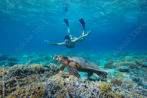 Turtle and girl Gili Indonesia photo