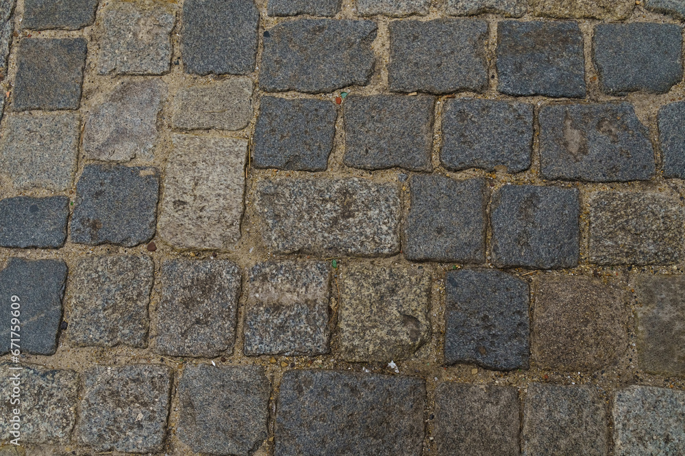 The road is paved with square granite stones. The road is paved with square granite stones.
