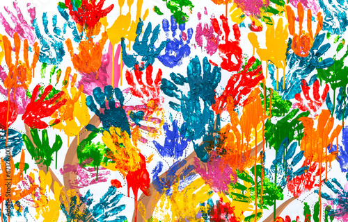 Multicolored colorful handprints on the wall as background © Alexandr Blinov