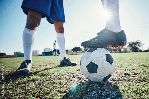 Legs, soccer and ball with players ready for kickoff on a sports field during a competitive game closeup. Football, fitness and teamwork on grass with a team standing in boots to start of a match © C. Daniels/peopleimages.com