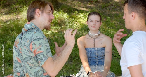 Girl and two guys talking. Romantic relationships among three individuals polyamory, involve consensually and openly loving and connecting with multiple partners simultaneously. photo