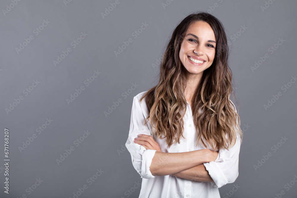 Smiling business woman posing with folded hands. Studio portrait confident businesswoman Smiling business woman posing with folded hands. Studio portrait confident businesswoman