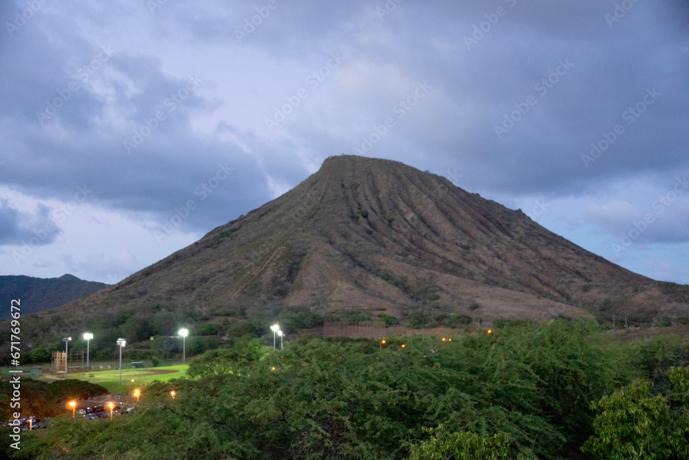 Fototapeta premium Koko Head Crater with stair trail up side visible at dusk