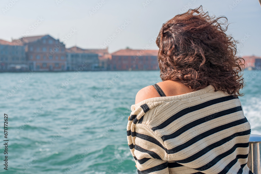 Fototapeta premium Latina woman on vacation in Venice city in Italy. Holidays and vacation concept