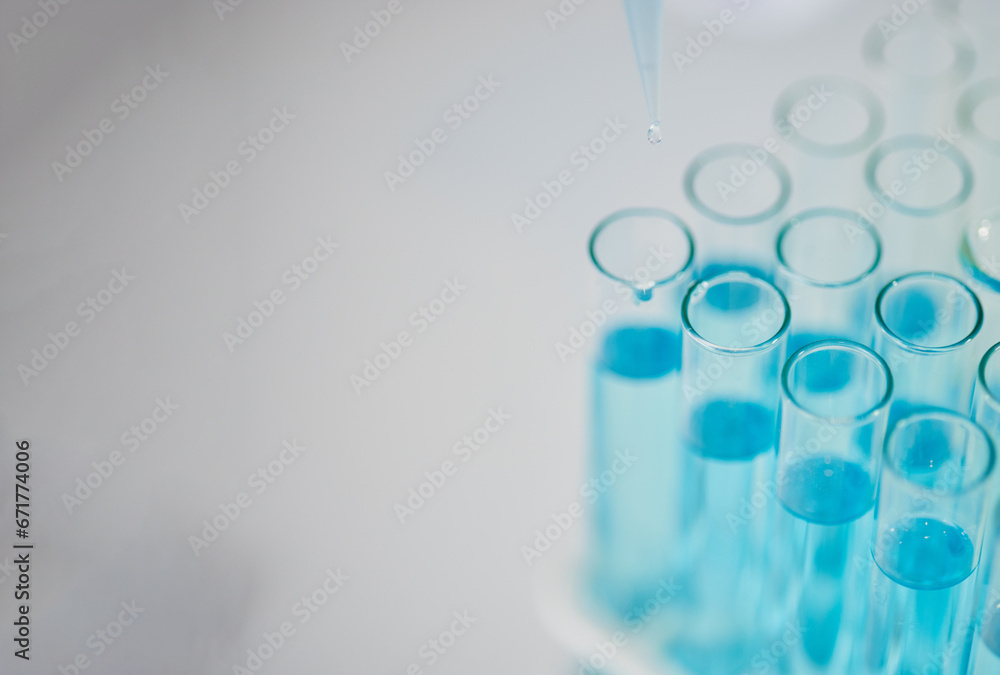 Blue chemical in test tube, science and closeup with mockup space, medical research and chemistry in lab. Scientific study, experiment and biotechnology with liquid solution in glass container Blue chemical in test tube, science and closeup with mockup space, medical research and chemistry in lab. Scientific study, experiment and biotechnology with liquid solution in glass container