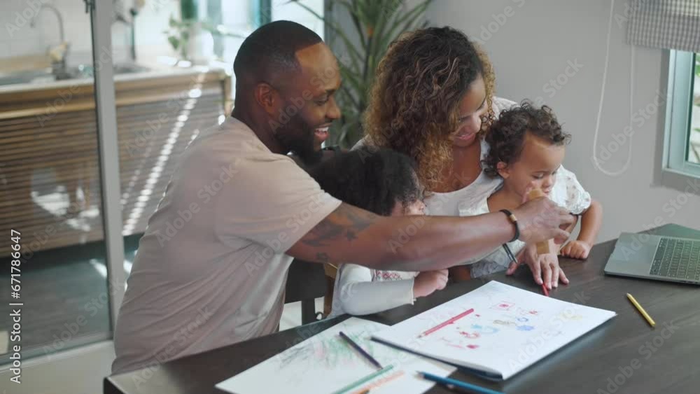 Happy African American parent playing and drawing with daughters in home Happy African American parent playing and drawing with daughters in home