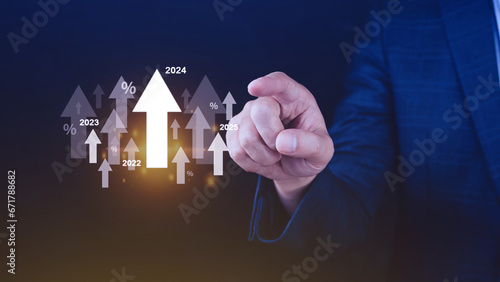 Interest rate and dividend concept, Businessman with percentage symbol and up arrow, 2024, Interest rates continue to increase, return on stocks and mutual funds, long term investment for retirement.