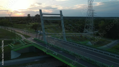 modern metal cable bridge over Bystrzyca river, sunset, Zeglarska street, Lublin photo