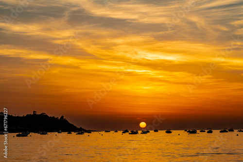 Sunset landscape with Plage du Sagnone, Corsica island, France photo