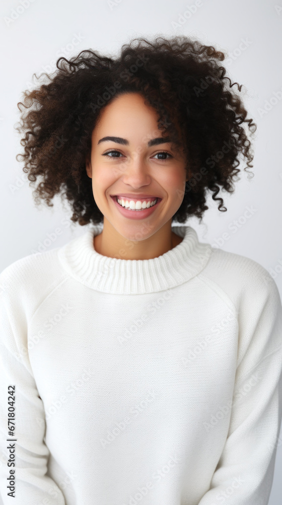 Radiant Warmth: Smiling Black Woman in White Sweater Exudes Positivity in Clean Setting. Radiant Warmth: Smiling Black Woman in White Sweater Exudes Positivity in Clean Setting.