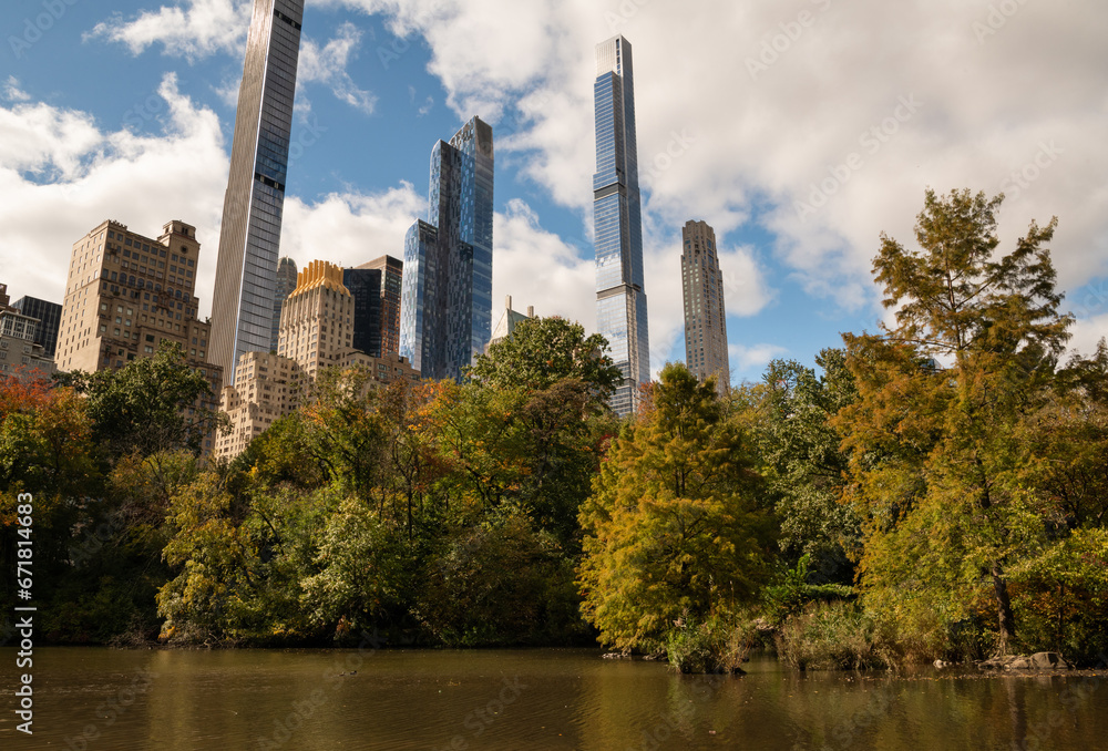 City Skyline behind autumn colored trees at Central Park, New York. Small escape place from busy city life