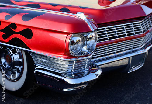 Photography front fender of vintage auto with bright red flames