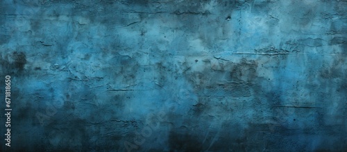 The background on the wall has a dark and abstract blue color design with a light blue texture pattern that has hints of cement and is illuminated by a black gradient