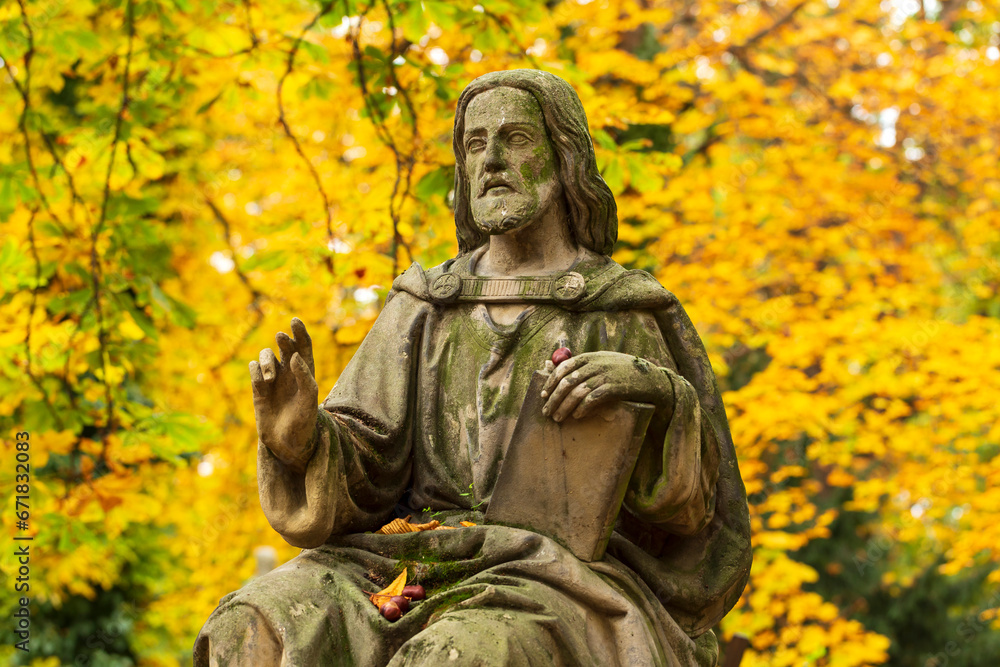 Historic Statue on the autumn mystery old Prague Cemetery, Czech Republic