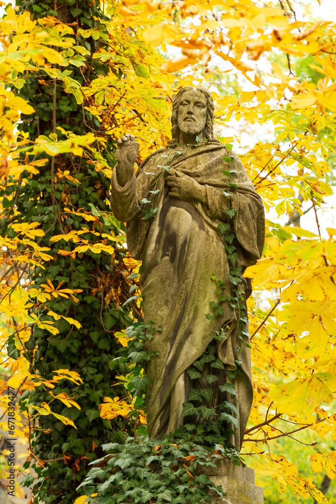 Historic Statue on the autumn mystery old Prague Cemetery, Czech Republic Historic Statue on the autumn mystery old Prague Cemetery, Czech Republic