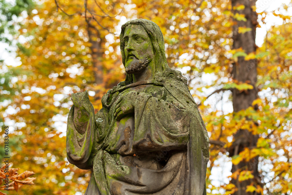 Historic Statue on the autumn mystery old Prague Cemetery, Czech Republic Historic Statue on the autumn mystery old Prague Cemetery, Czech Republic
