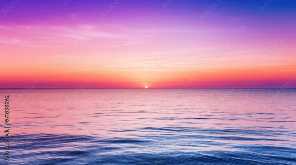 Tranquil sunset over the ocean, with a serene color gradient of purple, blue, orange, and pink. The warm sun reflects on the calm water, creating a peaceful and vibrant atmosphere