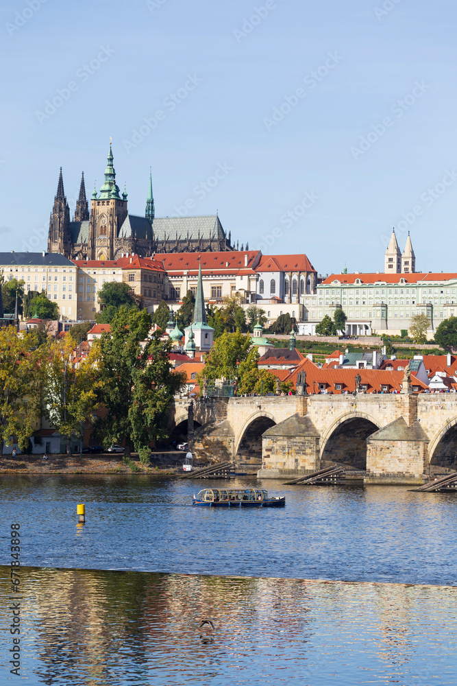 Obraz premium Autumn colorful Prague Lesser Town with gothic Castle above River Vltava in the sunny Day, Czech Republic