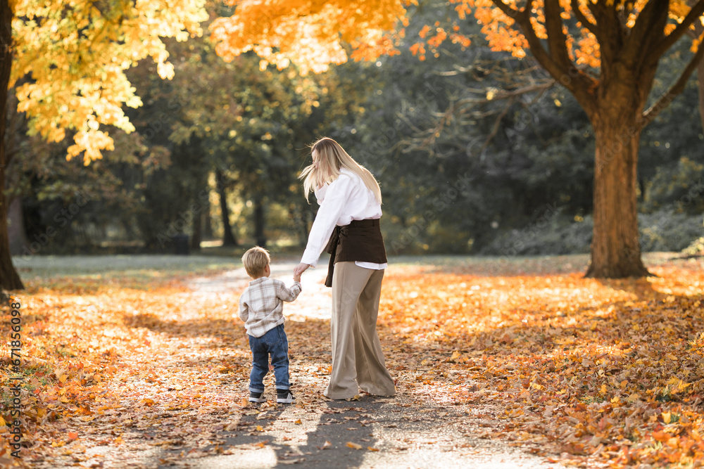 Mothers day, love family. Family on autumn walk in nature outdoors. Mother and child with hugging tenderness Mothers day, love family. Family on autumn walk in nature outdoors. Mother and child with hugging tenderness