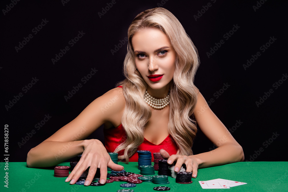 Photo of chic lady addicted poker player win every game hold collect chips on table over dark color background Photo of chic lady addicted poker player win every game hold collect chips on table over dark color background