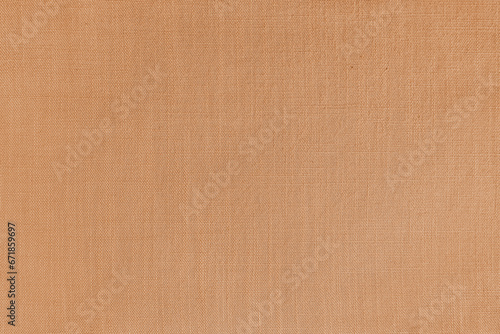 Texture background of orange linen fabric. Textile structure, cloth surface, weaving of natural cotton fabric closeup, backdrop, wallpaper.