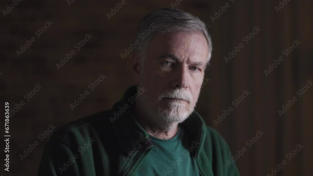 serious senior man looking at camera serious senior man looking at camera